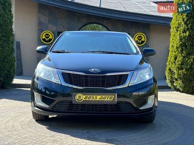 Черный Киа Рио, объемом двигателя 1.4 л и пробегом 215 тыс. км за 6999 $, фото 1 на Automoto.ua