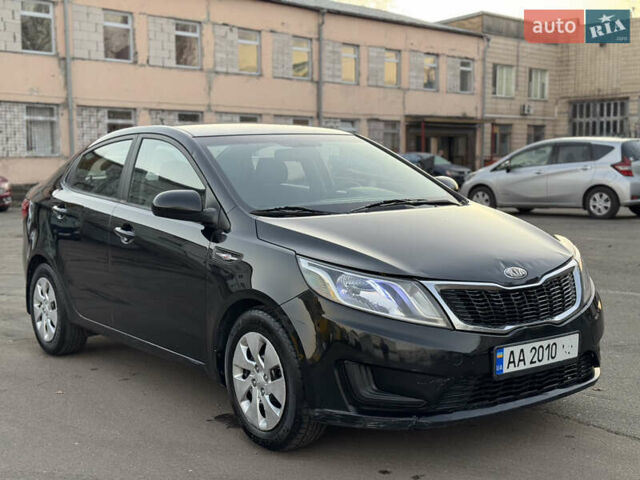 Черный Киа Рио, объемом двигателя 1.4 л и пробегом 305 тыс. км за 4950 $, фото 3 на Automoto.ua