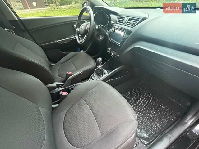 Чорний Кіа Ріо, об'ємом двигуна 1.4 л та пробігом 141 тис. км за 7200 $, фото 12 на Automoto.ua