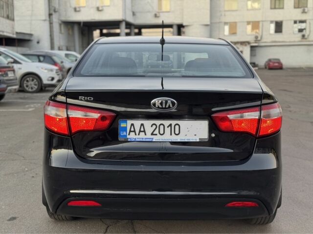 Черный Киа Рио, объемом двигателя 1.4 л и пробегом 305 тыс. км за 4750 $, фото 4 на Automoto.ua