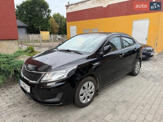 Чорний Кіа Ріо, об'ємом двигуна 1.4 л та пробігом 87 тис. км за 7700 $, фото 2 на Automoto.ua