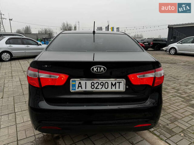 Черный Киа Рио, объемом двигателя 1.4 л и пробегом 185 тыс. км за 6999 $, фото 5 на Automoto.ua