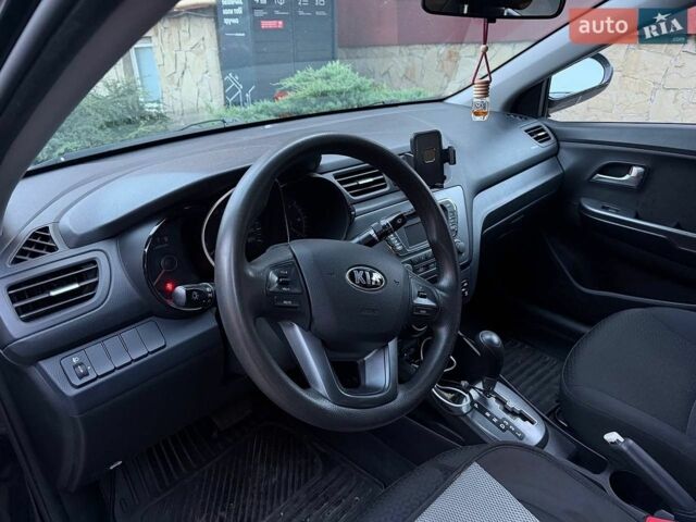Чорний Кіа Ріо, об'ємом двигуна 1.4 л та пробігом 87 тис. км за 7700 $, фото 10 на Automoto.ua
