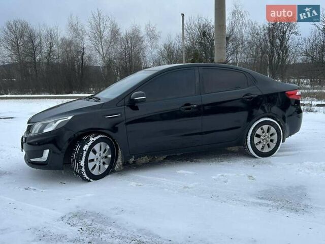 Черный Киа Рио, объемом двигателя 1.59 л и пробегом 107 тыс. км за 7950 $, фото 2 на Automoto.ua