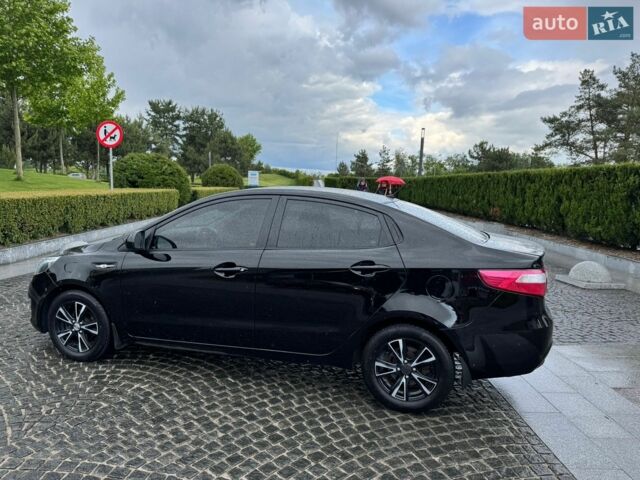 Чорний Кіа Ріо, об'ємом двигуна 1.4 л та пробігом 107 тис. км за 7500 $, фото 1 на Automoto.ua