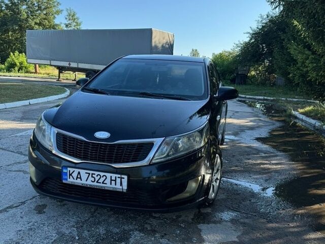Чорний Кіа Ріо, об'ємом двигуна 1.4 л та пробігом 179 тис. км за 8000 $, фото 5 на Automoto.ua