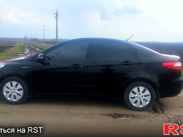 Чорний Кіа Ріо, об'ємом двигуна 1.6 л та пробігом 91 тис. км за 7800 $, фото 3 на Automoto.ua