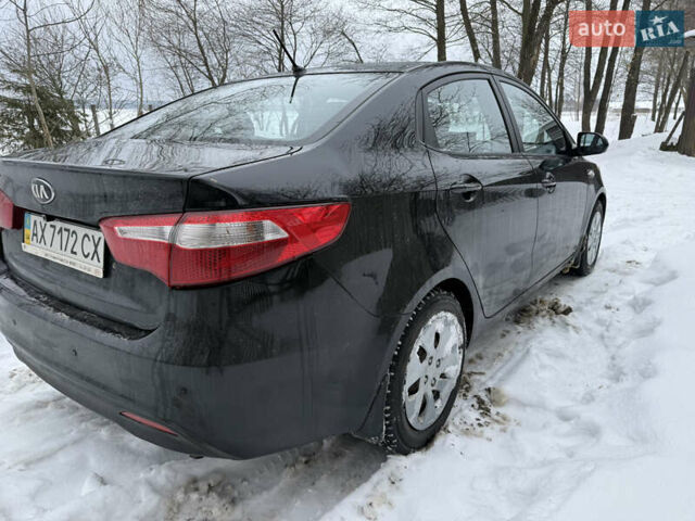 Чорний Кіа Ріо, об'ємом двигуна 1.4 л та пробігом 123 тис. км за 7300 $, фото 5 на Automoto.ua