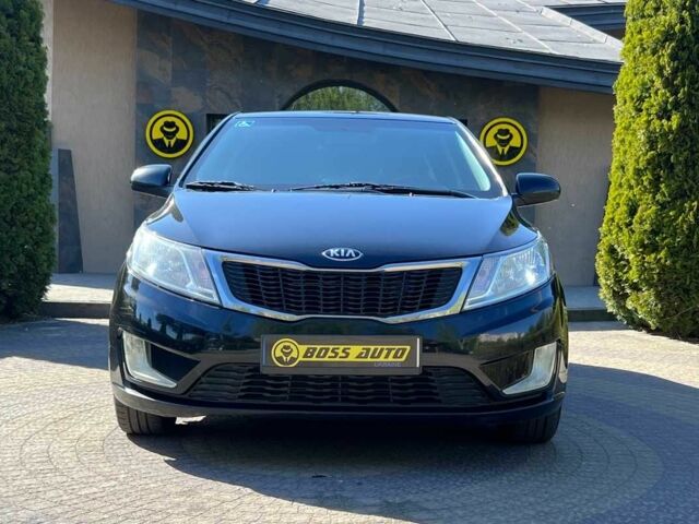 Черный Киа Рио, объемом двигателя 1.4 л и пробегом 215 тыс. км за 6999 $, фото 1 на Automoto.ua
