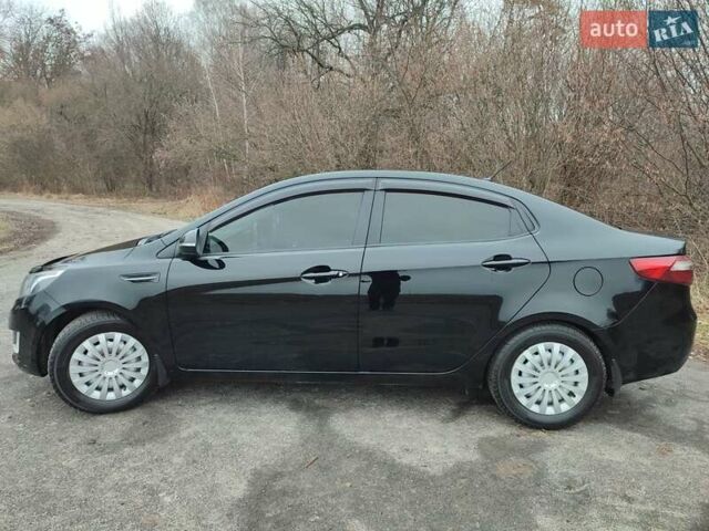Чорний Кіа Ріо, об'ємом двигуна 1.59 л та пробігом 87 тис. км за 9499 $, фото 5 на Automoto.ua