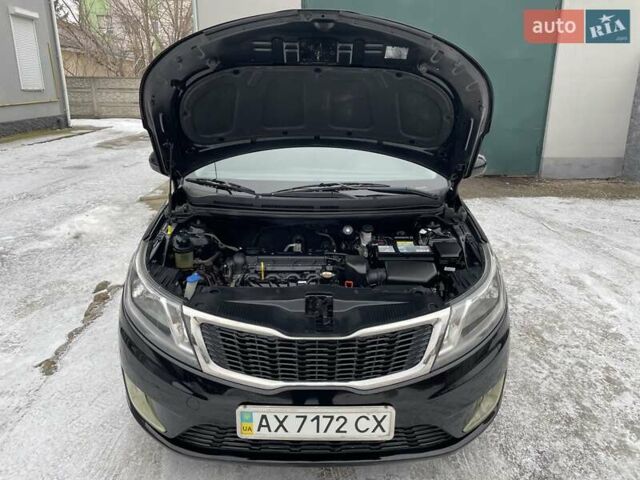 Черный Киа Рио, объемом двигателя 1.4 л и пробегом 124 тыс. км за 9350 $, фото 135 на Automoto.ua