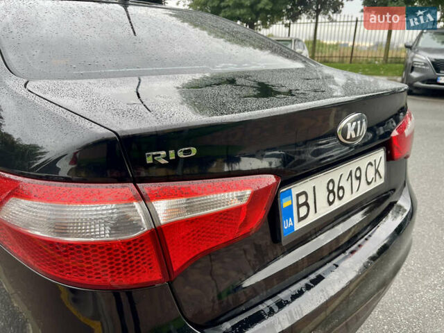 Чорний Кіа Ріо, об'ємом двигуна 1.4 л та пробігом 136 тис. км за 7950 $, фото 13 на Automoto.ua