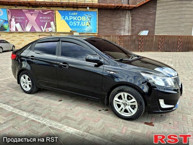 Чорний Кіа Ріо, об'ємом двигуна 14 л та пробігом 96 тис. км за 8600 $, фото 2 на Automoto.ua