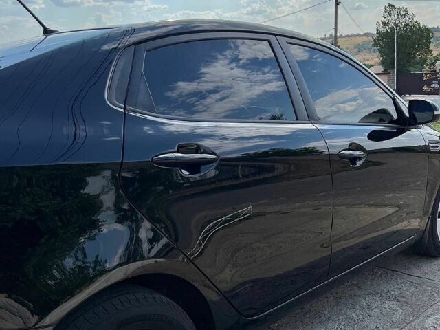 Чорний Кіа Ріо, об'ємом двигуна 1.59 л та пробігом 87 тис. км за 9499 $, фото 3 на Automoto.ua