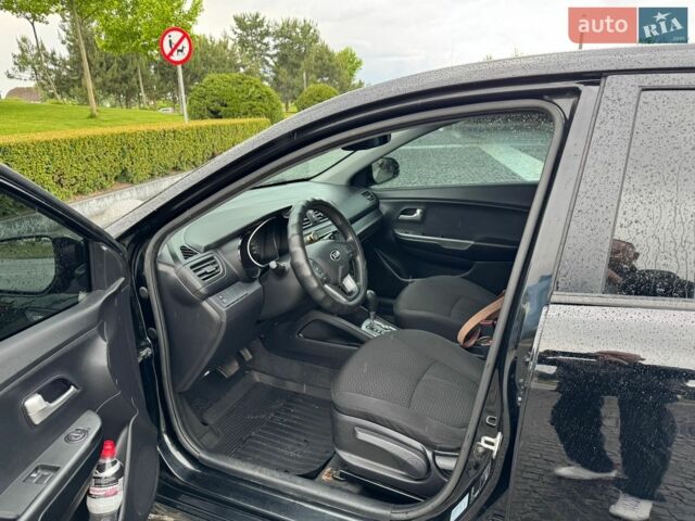 Чорний Кіа Ріо, об'ємом двигуна 1.4 л та пробігом 107 тис. км за 7500 $, фото 9 на Automoto.ua