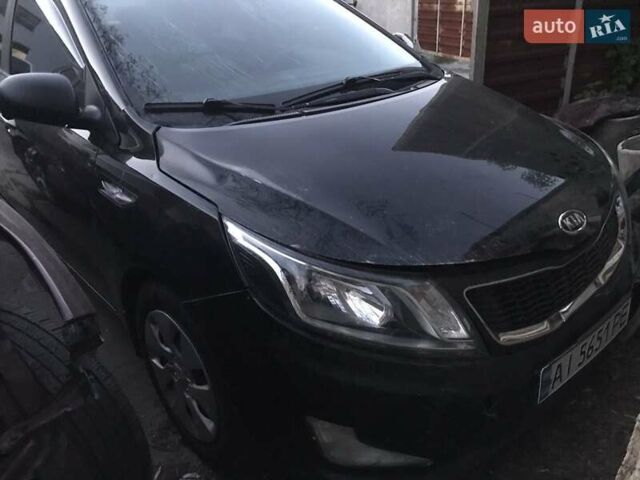 Чорний Кіа Ріо, об'ємом двигуна 1.4 л та пробігом 102 тис. км за 4444 $, фото 4 на Automoto.ua