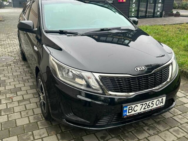 Черный Киа Рио, объемом двигателя 1.4 л и пробегом 141 тыс. км за 7200 $, фото 1 на Automoto.ua