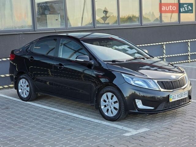 Черный Киа Рио, объемом двигателя 1.6 л и пробегом 192 тыс. км за 6999 $, фото 1 на Automoto.ua