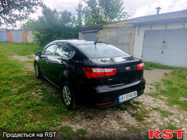 Чорний Кіа Ріо, об'ємом двигуна 1.4 л та пробігом 179 тис. км за 6100 $, фото 5 на Automoto.ua