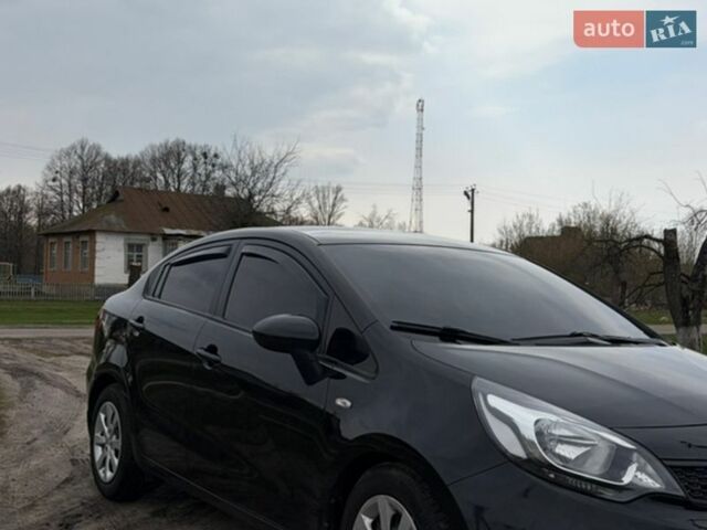 Черный Киа Рио, объемом двигателя 1.25 л и пробегом 100 тыс. км за 8300 $, фото 1 на Automoto.ua