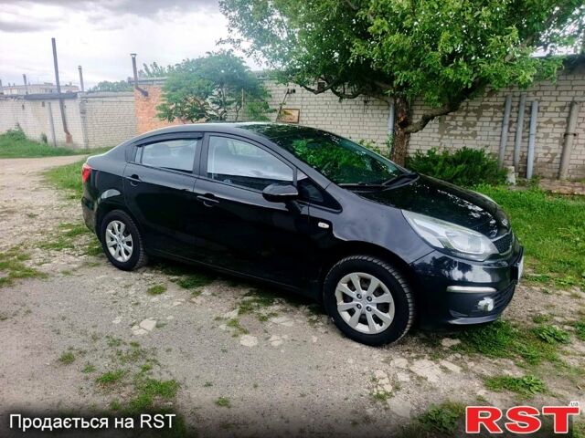 Чорний Кіа Ріо, об'ємом двигуна 1.4 л та пробігом 179 тис. км за 6100 $, фото 1 на Automoto.ua