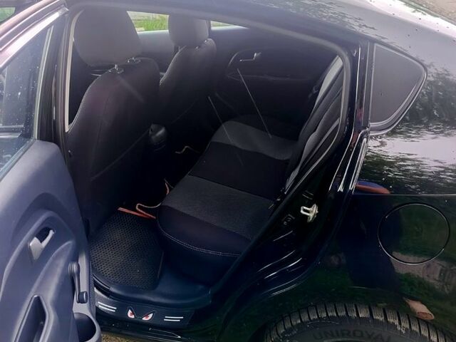 Чорний Кіа Ріо, об'ємом двигуна 1.4 л та пробігом 179 тис. км за 6100 $, фото 6 на Automoto.ua