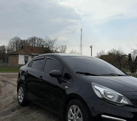 Чорний Кіа Ріо, об'ємом двигуна 1.25 л та пробігом 100 тис. км за 7500 $, фото 1 на Automoto.ua