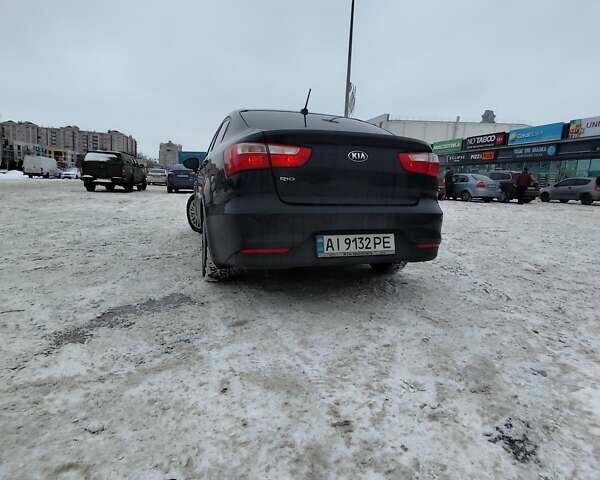 Черный Киа Рио, объемом двигателя 1.6 л и пробегом 180 тыс. км за 8799 $, фото 1 на Automoto.ua