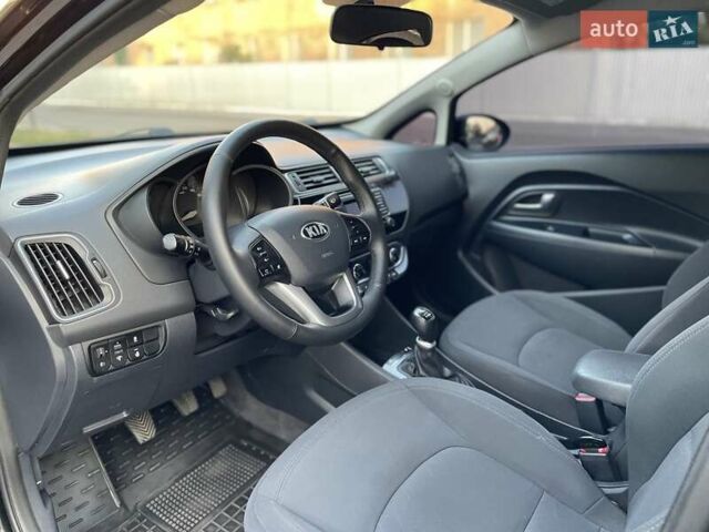 Чорний Кіа Ріо, об'ємом двигуна 1.4 л та пробігом 95 тис. км за 8999 $, фото 11 на Automoto.ua