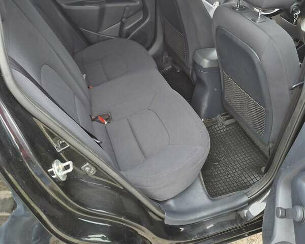 Черный Киа Рио, объемом двигателя 1.4 л и пробегом 115 тыс. км за 9500 $, фото 5 на Automoto.ua