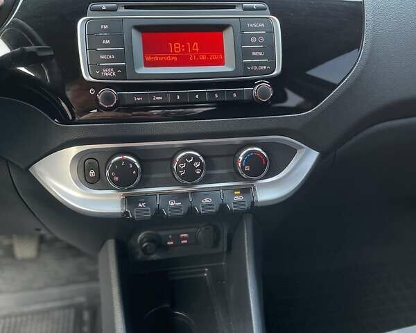 Чорний Кіа Ріо, об'ємом двигуна 1.4 л та пробігом 95 тис. км за 8999 $, фото 14 на Automoto.ua