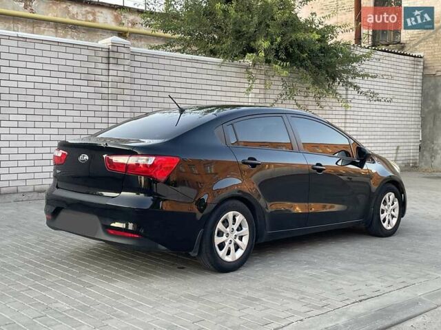 Чорний Кіа Ріо, об'ємом двигуна 1.4 л та пробігом 95 тис. км за 8999 $, фото 7 на Automoto.ua