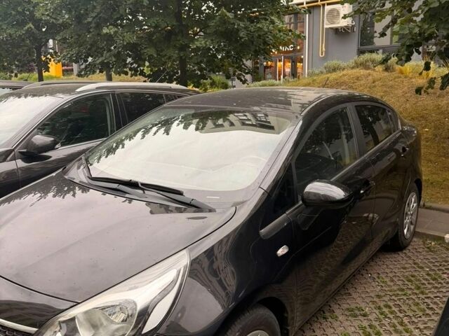 Чорний Кіа Ріо, об'ємом двигуна 1.4 л та пробігом 79 тис. км за 11500 $, фото 4 на Automoto.ua