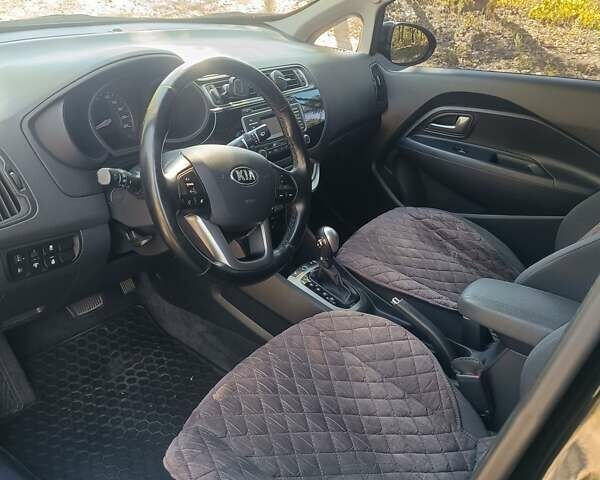 Чорний Кіа Ріо, об'ємом двигуна 1.4 л та пробігом 85 тис. км за 12500 $, фото 4 на Automoto.ua