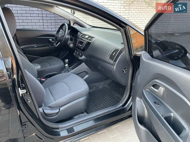 Чорний Кіа Ріо, об'ємом двигуна 1.4 л та пробігом 95 тис. км за 8999 $, фото 21 на Automoto.ua