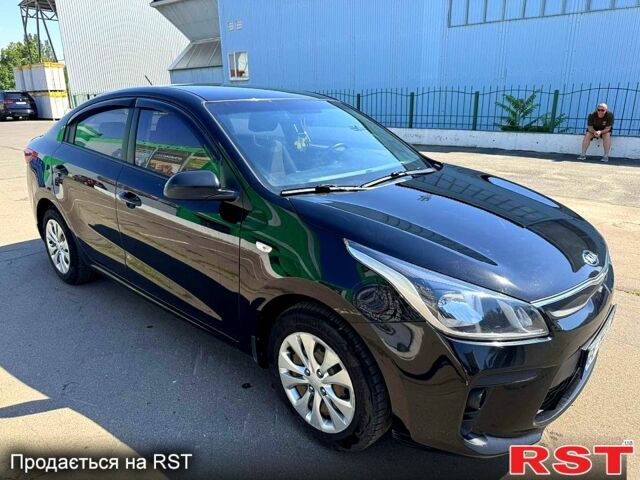 Чорний Кіа Ріо, об'ємом двигуна 1.4 л та пробігом 145 тис. км за 11500 $, фото 1 на Automoto.ua