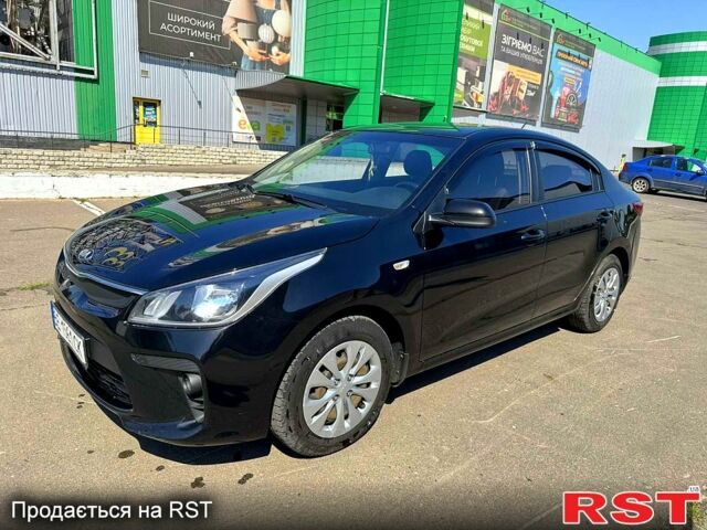 Чорний Кіа Ріо, об'ємом двигуна 1.4 л та пробігом 145 тис. км за 11500 $, фото 3 на Automoto.ua