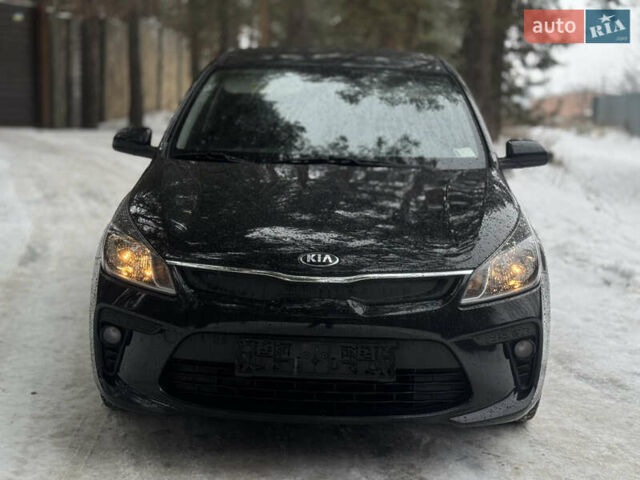 Чорний Кіа Ріо, об'ємом двигуна 1.4 л та пробігом 66 тис. км за 14200 $, фото 1 на Automoto.ua