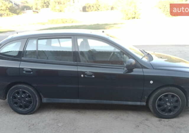 Черный Киа Рио, объемом двигателя 1.34 л и пробегом 230 тыс. км за 3400 $, фото 1 на Automoto.ua