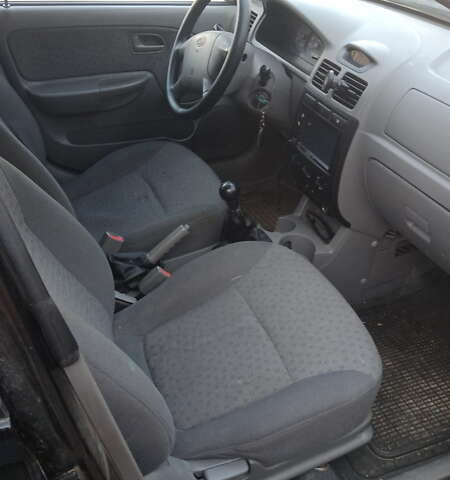 Черный Киа Рио, объемом двигателя 1.34 л и пробегом 230 тыс. км за 3400 $, фото 2 на Automoto.ua