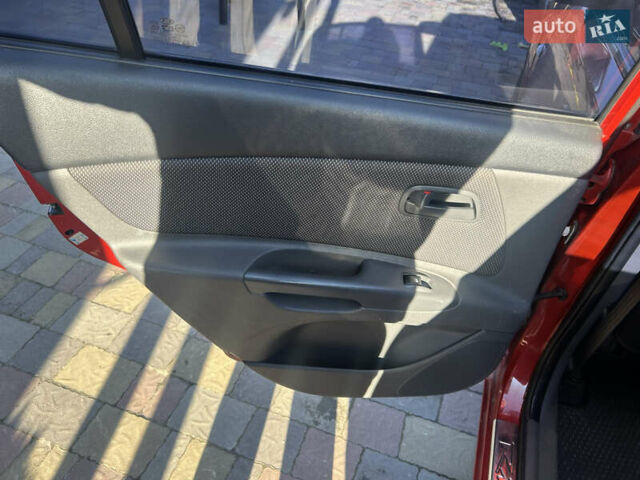 Красный Киа Рио, объемом двигателя 1.4 л и пробегом 230 тыс. км за 4300 $, фото 5 на Automoto.ua