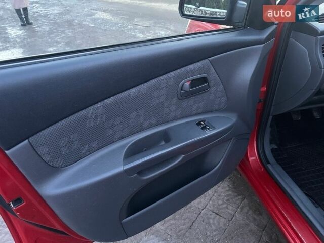 Червоний Кіа Ріо, об'ємом двигуна 1.4 л та пробігом 213 тис. км за 3450 $, фото 10 на Automoto.ua