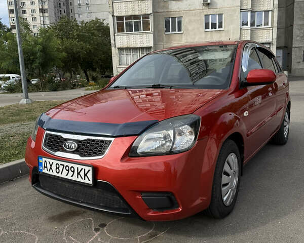 Червоний Кіа Ріо, об'ємом двигуна 1.4 л та пробігом 114 тис. км за 5500 $, фото 1 на Automoto.ua