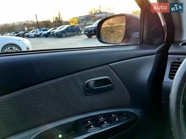 Червоний Кіа Ріо, об'ємом двигуна 1.4 л та пробігом 171 тис. км за 5700 $, фото 12 на Automoto.ua