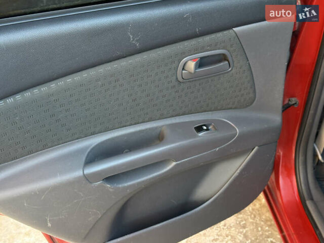 Красный Киа Рио, объемом двигателя 1.4 л и пробегом 272 тыс. км за 3999 $, фото 51 на Automoto.ua
