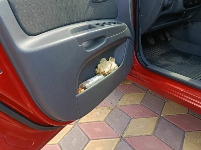 Червоний Кіа Ріо, об'ємом двигуна 1.4 л та пробігом 137 тис. км за 4600 $, фото 21 на Automoto.ua