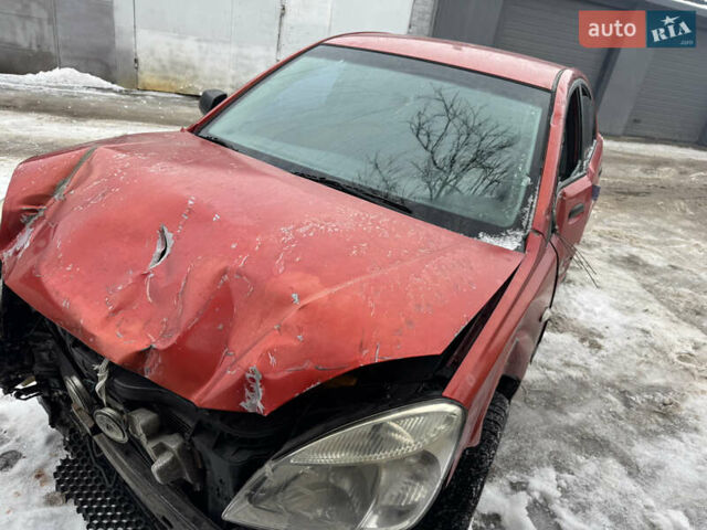 Червоний Кіа Ріо, об'ємом двигуна 1.4 л та пробігом 240 тис. км за 1750 $, фото 3 на Automoto.ua