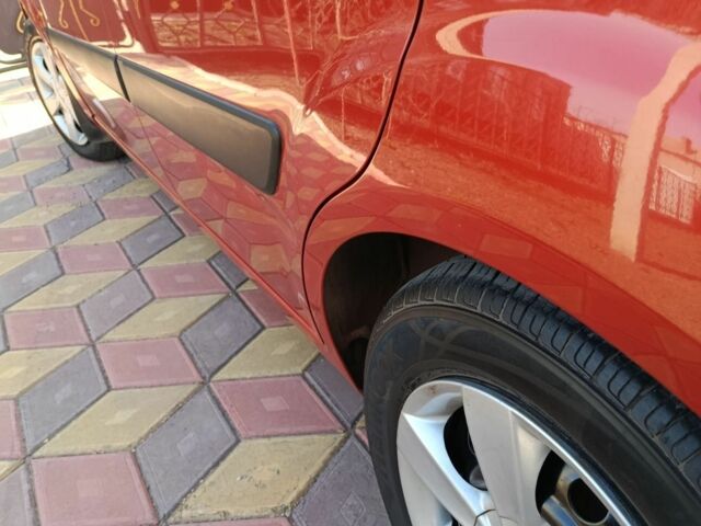 Червоний Кіа Ріо, об'ємом двигуна 1.4 л та пробігом 137 тис. км за 4600 $, фото 11 на Automoto.ua