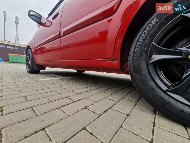 Червоний Кіа Ріо, об'ємом двигуна 1.4 л та пробігом 275 тис. км за 4200 $, фото 1 на Automoto.ua