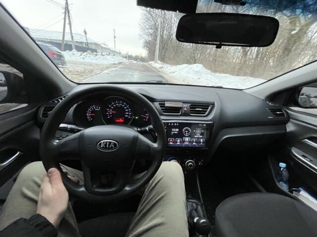 Червоний Кіа Ріо, об'ємом двигуна 1.4 л та пробігом 212 тис. км за 6000 $, фото 11 на Automoto.ua